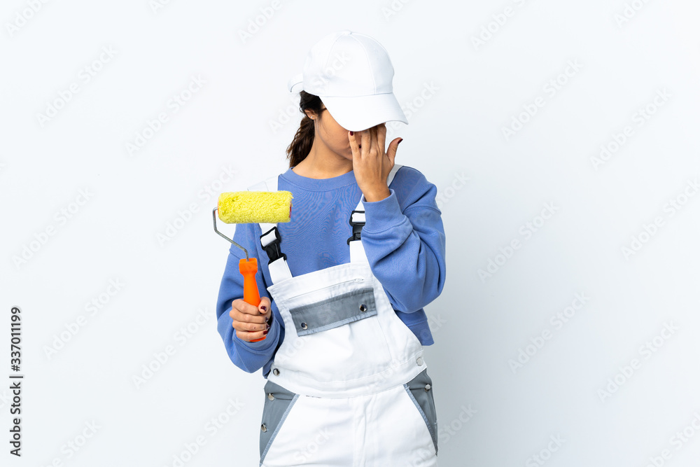 Painter woman over isolated white background with headache Painter woman over isolated white background with headache