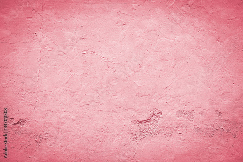 Red background with vignette effect. Pastel red wall with embossed surface. 