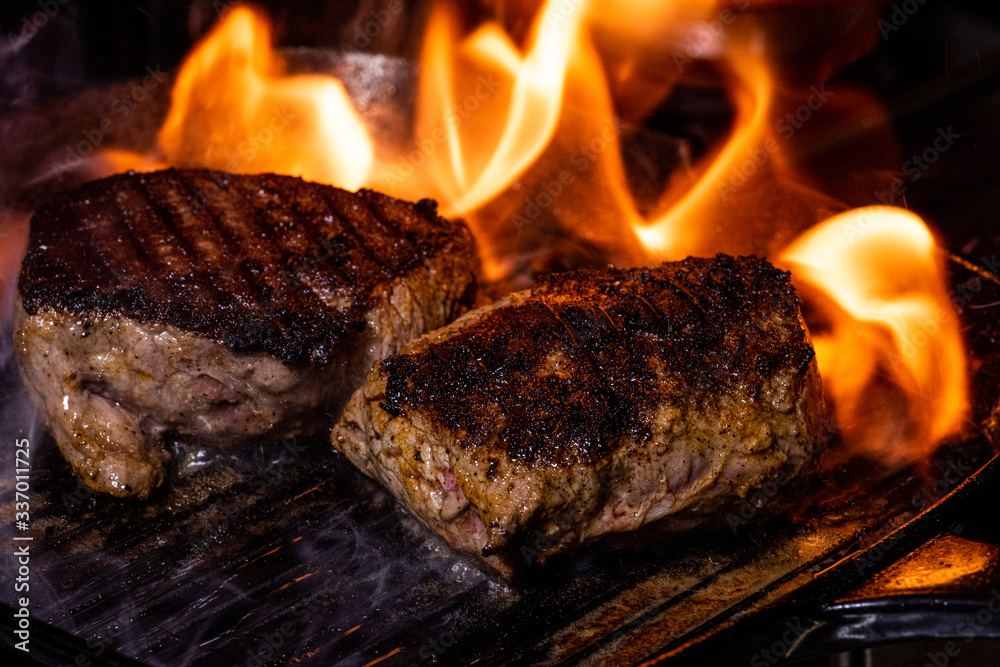 flaming steak on a cast iron griddle flaming steak on a cast iron griddle