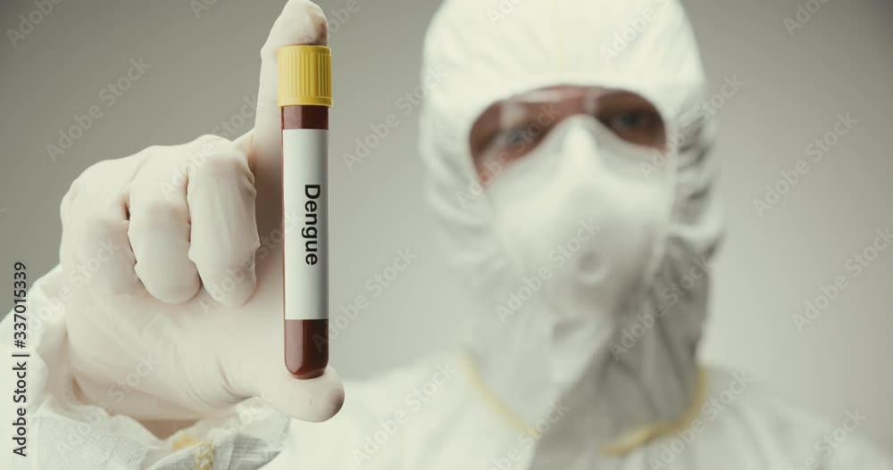 Scientist laboratory protection glasses test tube concept Dengue blood gray background Scientist laboratory protection glasses test tube concept Dengue blood gray background