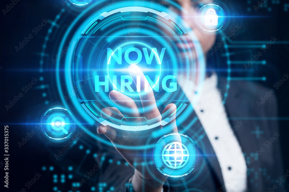 Business, Technology, Internet and network concept. Young businessman working on a virtual screen of the future and sees the inscription: Now hiring Business, Technology, Internet and network concept. Young businessman working on a virtual screen of the future and sees the inscription: Now hiring