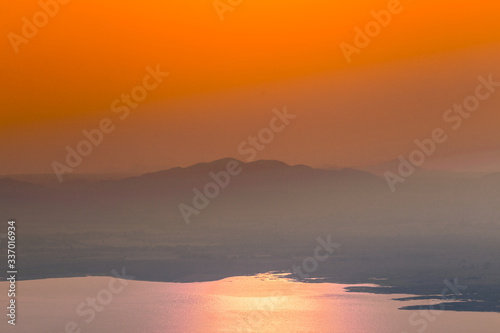 Natural blurred natural background, high angle viewpoint area, overlooking trees and mountains and large windmills,abundance of forests © bangprik