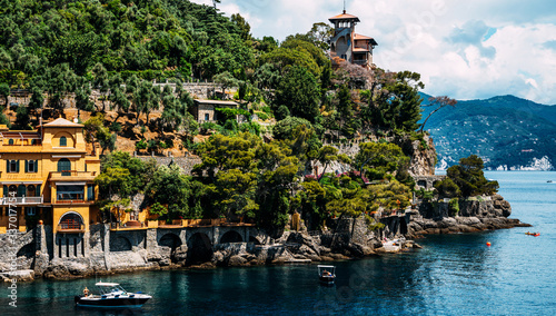 Morning view of Liguria coastline of mediterranean sea. luxury villas in the stunning botanical garden decorated with mediterranean flowers and trees. Italy, Europe.