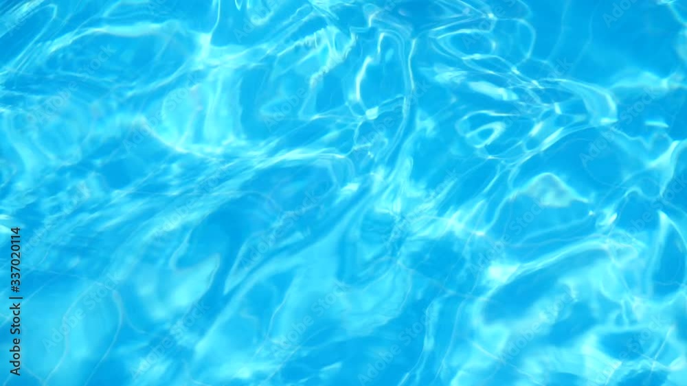 Glare from the sun on the water in the pool.