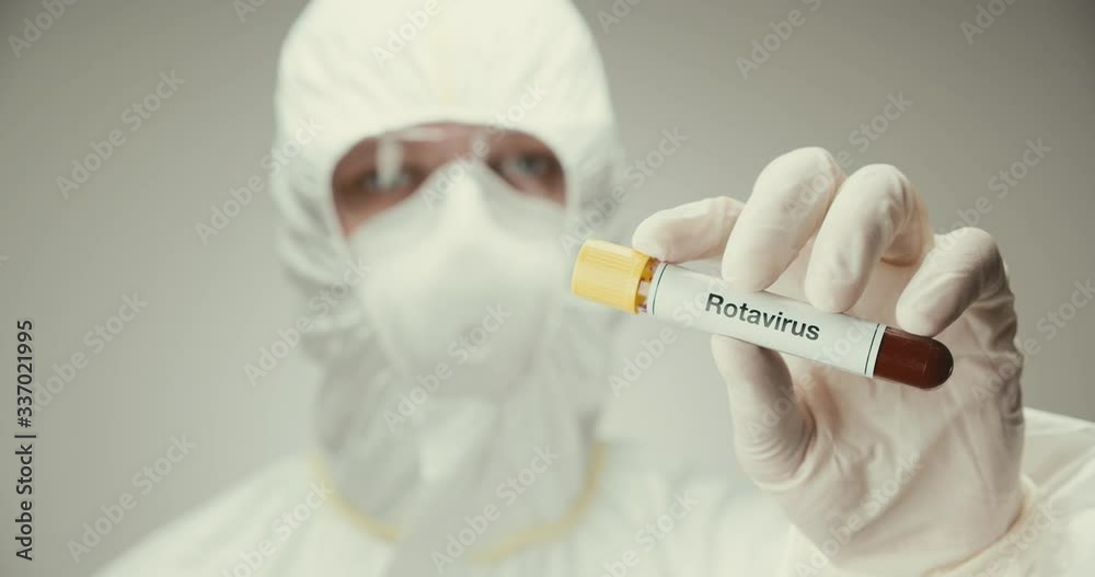 Scientist laboratory protection glasses test tube concept Rotavirus blood gray background showing Scientist laboratory protection glasses test tube concept Rotavirus blood gray background showing