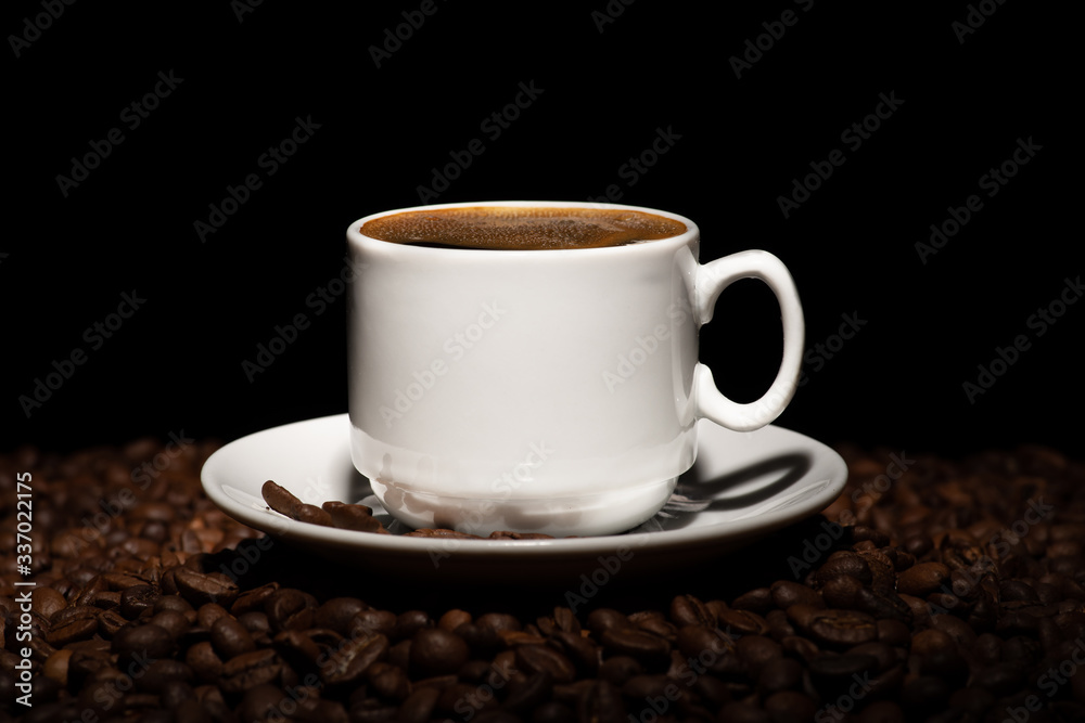Cup with coffee beans on a dark background Cup with coffee beans on a dark background