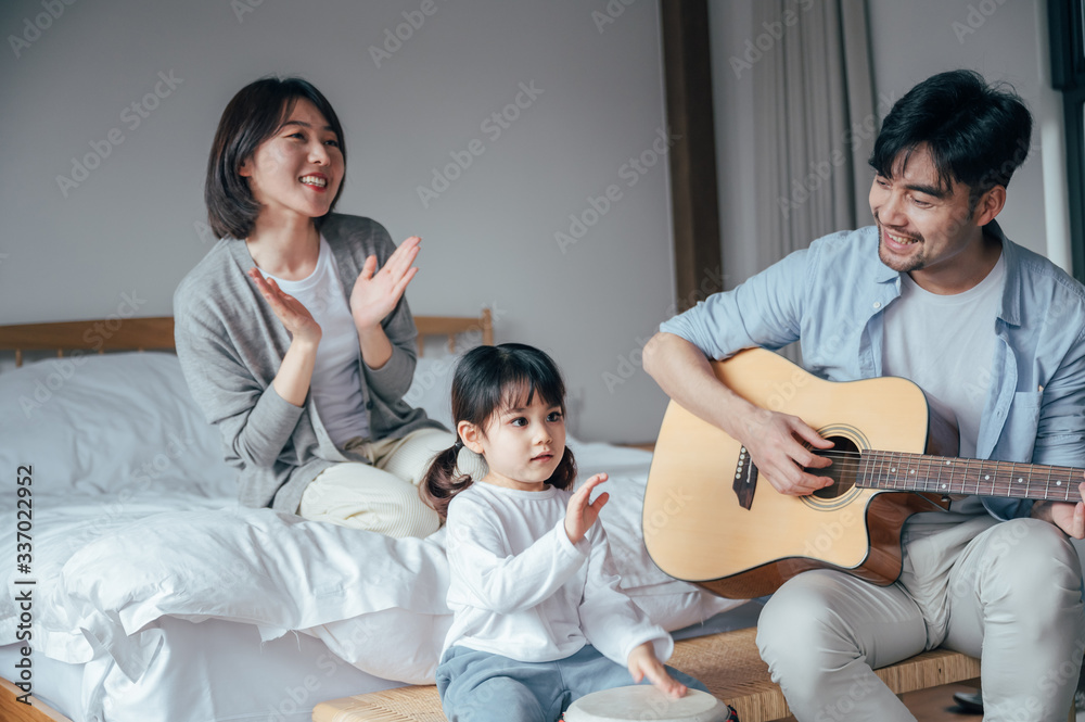 Mom and Dad and daughter sing at home Mom and Dad and daughter sing at home