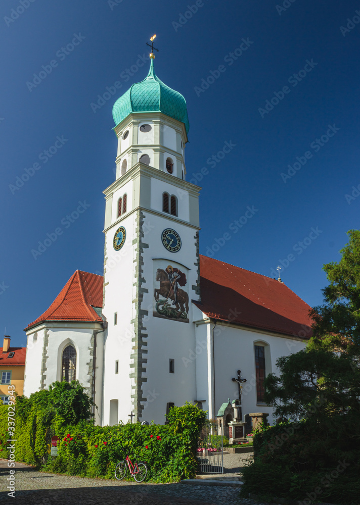 Beautiful bell tower of St. Georg Church. Wasserburg Bodensee Germany. Soft focus, blurry background.
