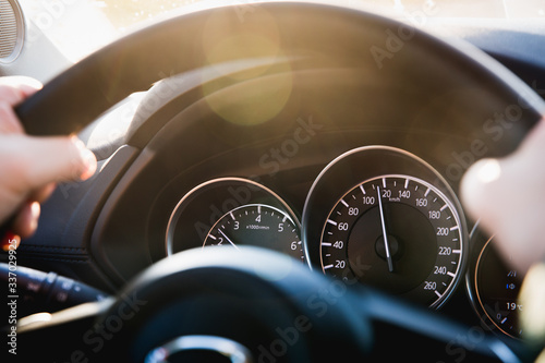 Speedometer of a car close-up, with the arrow frozen at a speed of 120 km/h. Details and interior of a black luxury car. photo