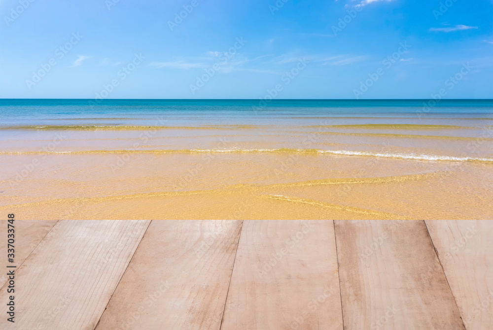 Fototapeta premium Wood table top on the sea with blue sky background
