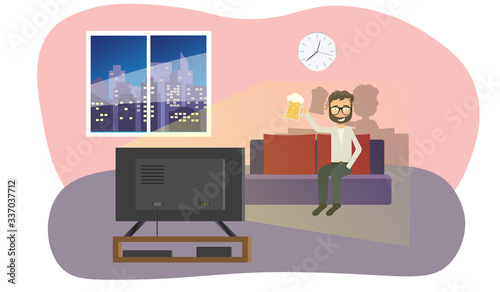 Man watches TV and drinks a beer