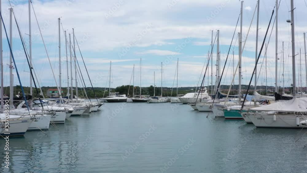 Sailboats parked in Marine port - Aerial Drone View Sailboats parked in Marine port - Aerial Drone View