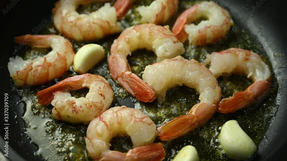 prawns fried in a pan with garlic prawns fried in a pan with garlic