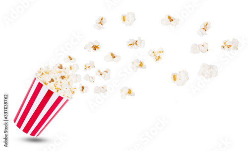 Popcorn in red and white cardboard box for cinema isolated on white background
