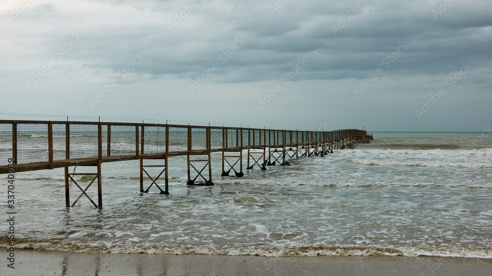 Seascape with the sea and pier
