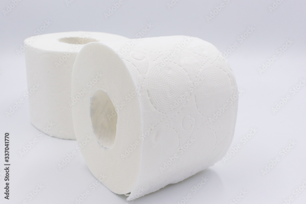 White toilet paper, rolled, on white, background, copy space. White toilet paper, rolled, on white, background, copy space.