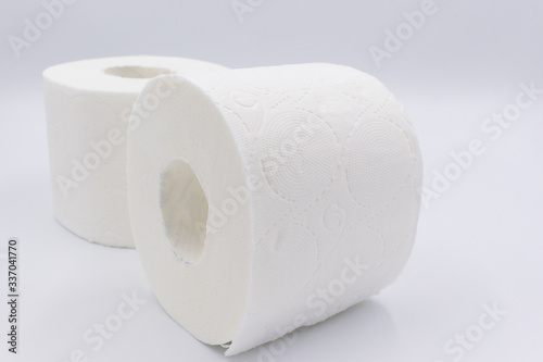 White toilet paper, rolled, on white, background, copy space.