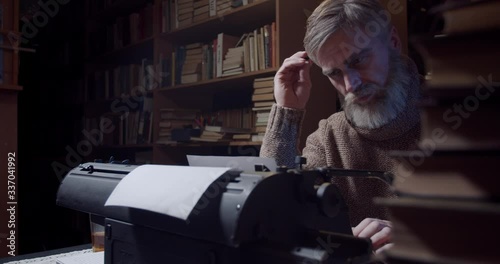 Footage of the amazing Ernest Hemingway working at the library, writing, 4k photo