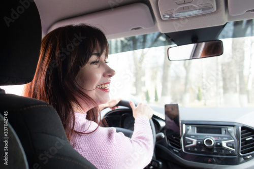 Girl behind the wheel smiles © vilma3000