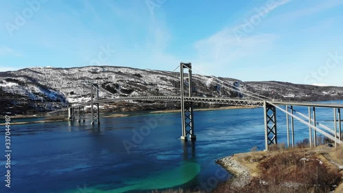 The Tjeldsund Bridge is a suspension road bridge that crosses the Tjeldsundet strait between the mainland and the island of Hinnøya in Troms og Finnmark county, Norway. photo