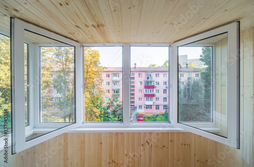 White metal-plastic windows of balcony in modern apartment
