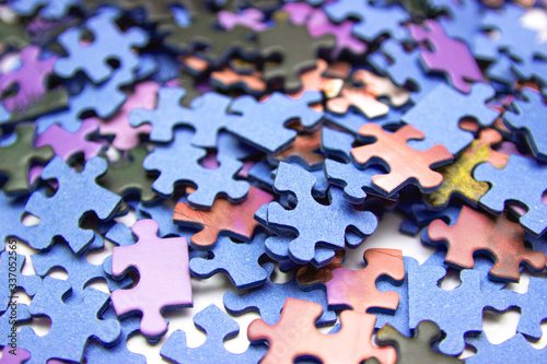 Jigsaw puzzle color background. Selective focus of pieces puzzle jigsaw, puzzle background.