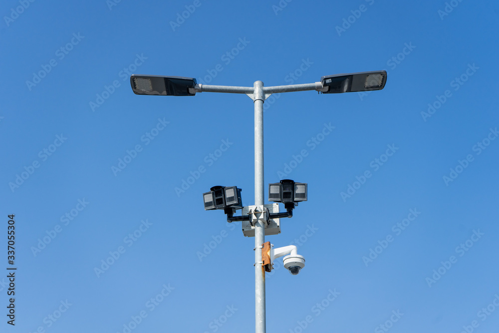 Automated car parking sensors on a lamp post in a car park Automated car parking sensors on a lamp post in a car park