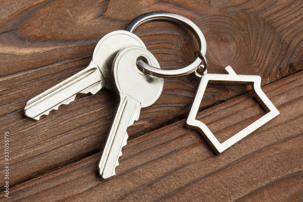 House keys on wooden background Stock Photo | Adobe Stock