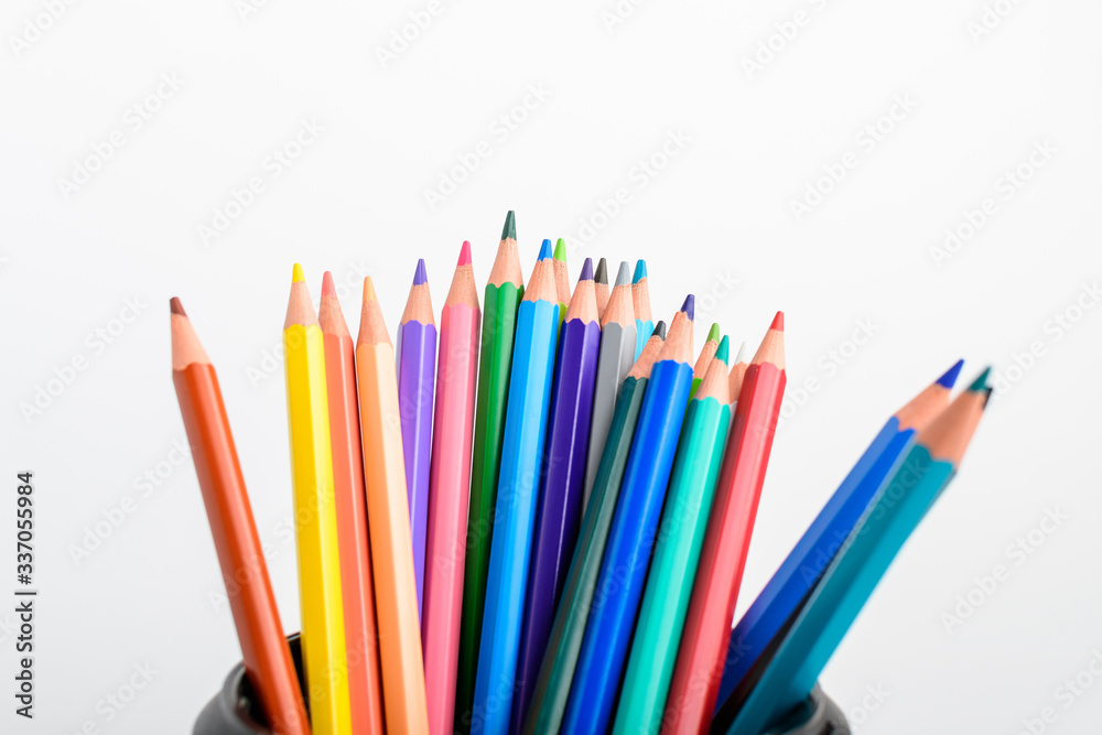Group of many mixed colourful pencils in a black box isolated on a white table, children school or office suppliers photographed with soft focus from side view, with space for text
Group of many mixed colourful pencils in a black box isolated on a white table, children school or office suppliers photographed with soft focus from side view, with space for text