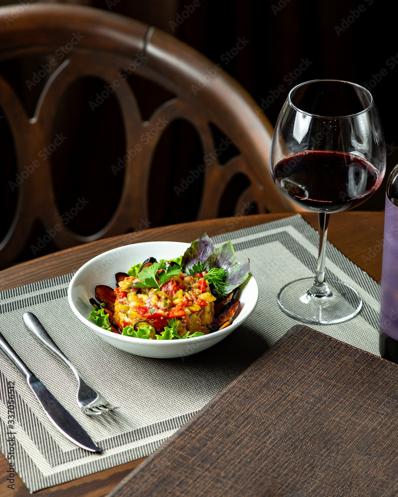 salad with eggplant and glass of red wine salad with eggplant and glass of red wine