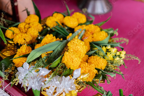 .Koh Samui, Thailand - 9 march 2020: Wat Ratchathammaram, Buddhist tradition of worship and flower offering to monks