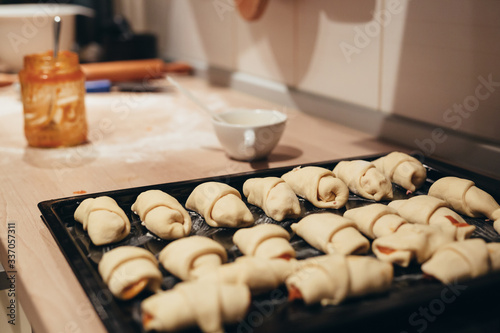woman preparing basic dough rolls in kitchen