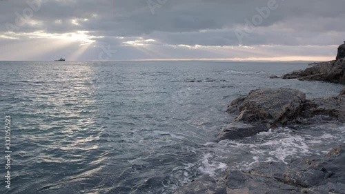 Sunbeams over the ocean, in Cornwall, England. 
(Shot on Arri Alexa Mini LF)