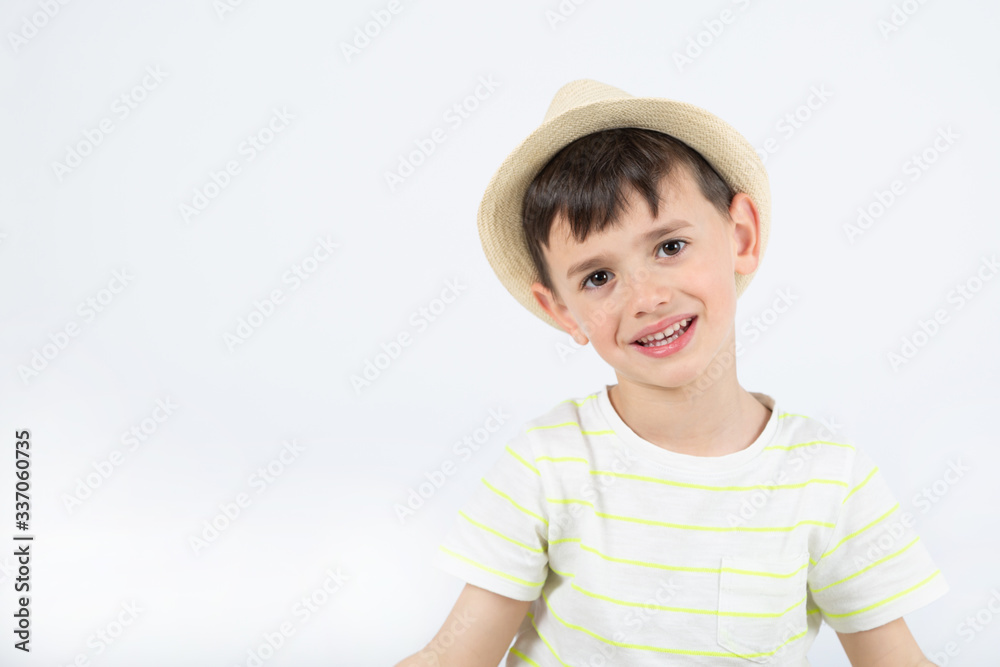 happy boy in hat prepared for vacation on white background happy boy in hat prepared for vacation on white background