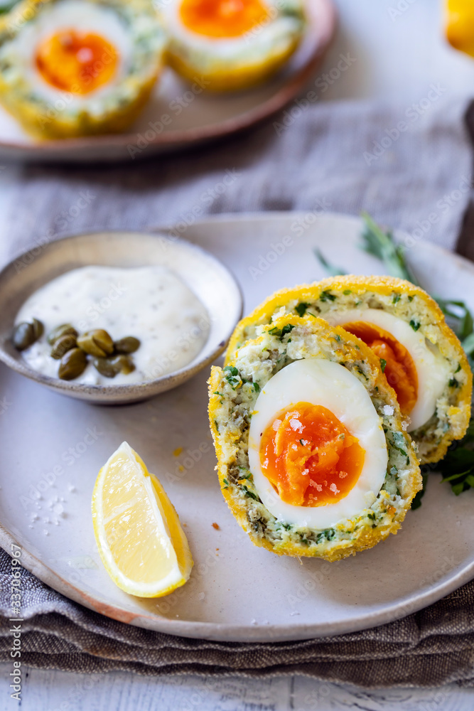 Scotch eggs wrapped with smoked haddock and cod