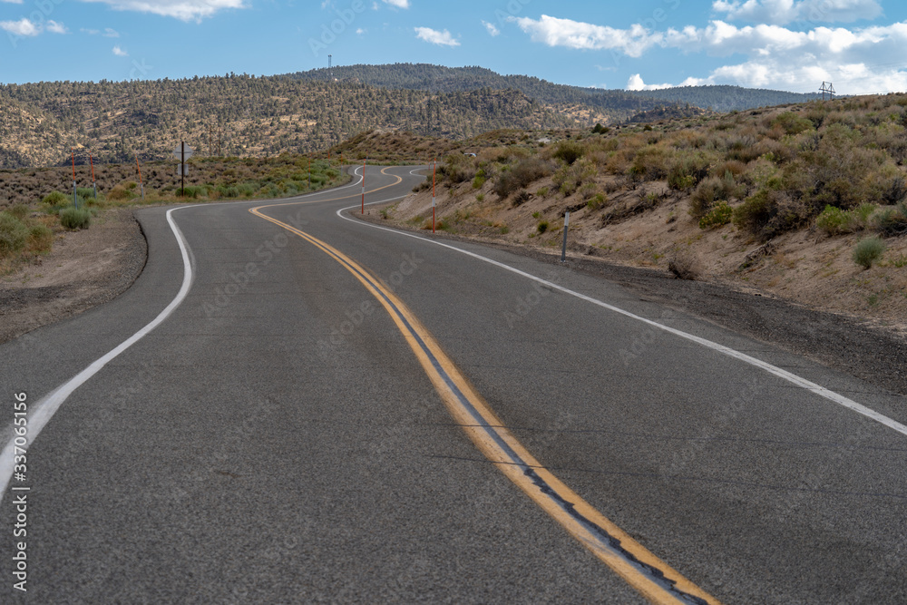 Winding road through high desert scenery in the Eastern Sierra Mountains in California Winding road through high desert scenery in the Eastern Sierra Mountains in California