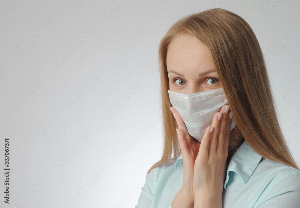 woman with medical mask. portrait of blonde girl. anxiety, excitement and fear of contracting a virus concept woman with medical mask. portrait of blonde girl. anxiety, excitement and fear of contracting a virus concept