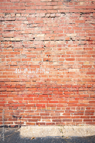 Old brick wall in back lot.