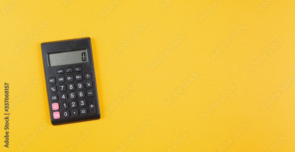 top view of pocket calculator on orange background, business calculation and finance concept top view of pocket calculator on orange background, business calculation and finance concept
