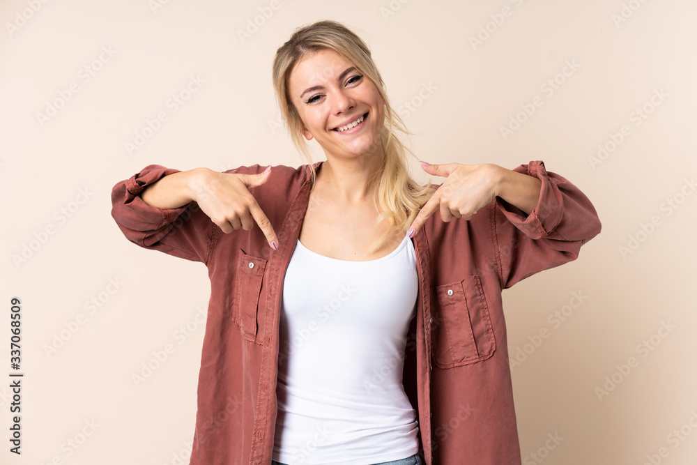 Blonde woman over isolated background proud and self-satisfied Blonde woman over isolated background proud and self-satisfied