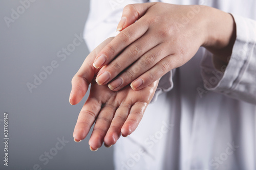 doctor washing hands in gel