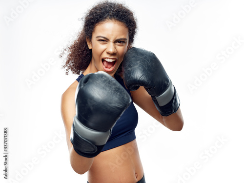 Athletic woman doing boxing gloves exercise