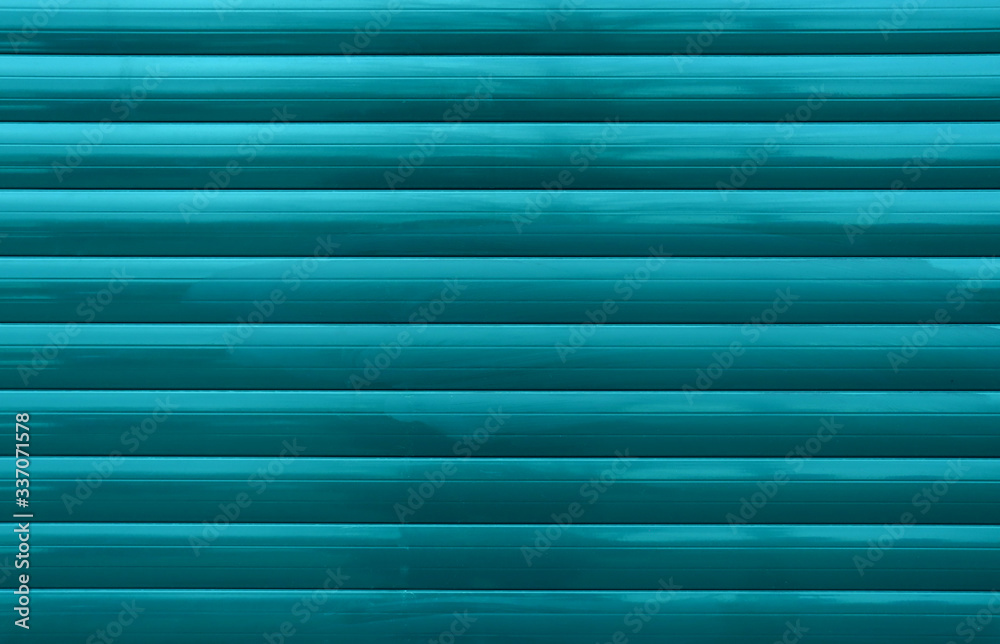 Turquoise pencils in a row. Background of turquoise straight glossy lines for design