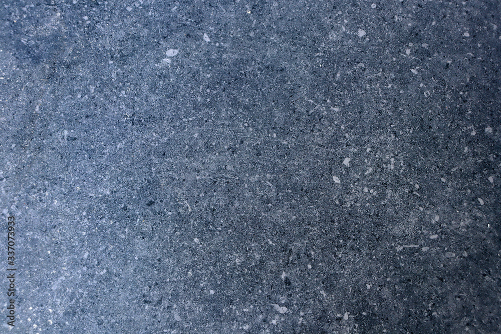 The texture of granite chips. Background of blue granite. Abstract blue background