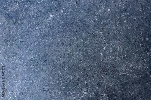 The texture of granite chips. Background of blue granite. Abstract blue background