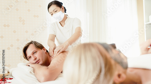New normal service delivery concept, Masseuse or chiropractor service at home to prevent and avoid infection from public area.