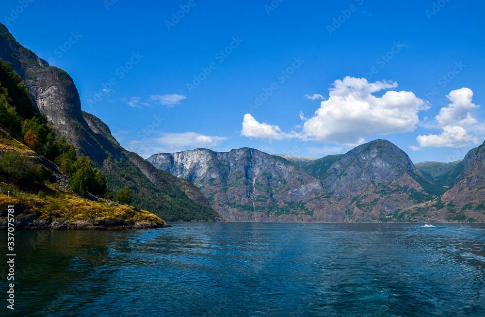 Beautiful view on summer sunny day on Sognefjord or Sognefjorden (the King of the Fjords), the largest and deepest fjord in Norway, Scandinavia. Tourism vacation and travel.