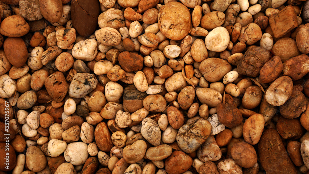 brown small stone background. pebble beach stone garden brown small stone background. pebble beach stone garden