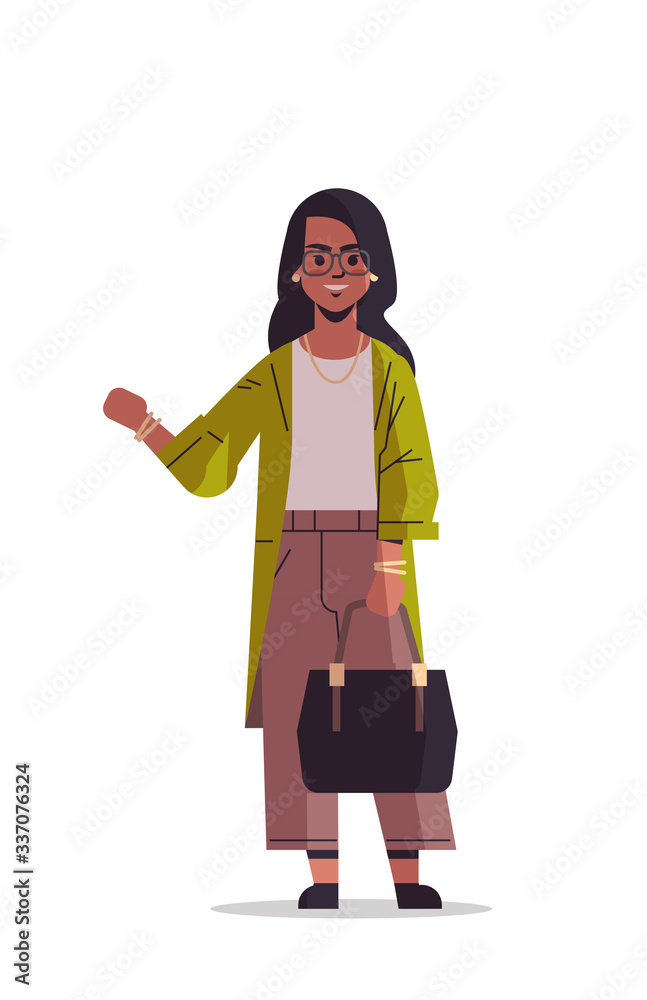 beautiful indian woman with handbag waving hand and posing to camera smiling female cartoon character standing pose isolated vertical full length vector illustration