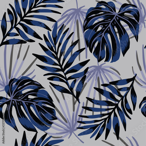 Tropical abstract leaves pattern on gray background